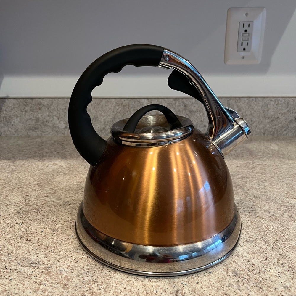 Copper and black tea kettle